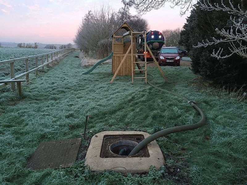 Septic tank being emptied by tanker