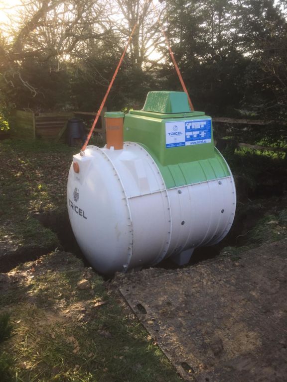 Tricel septic tank being positioned